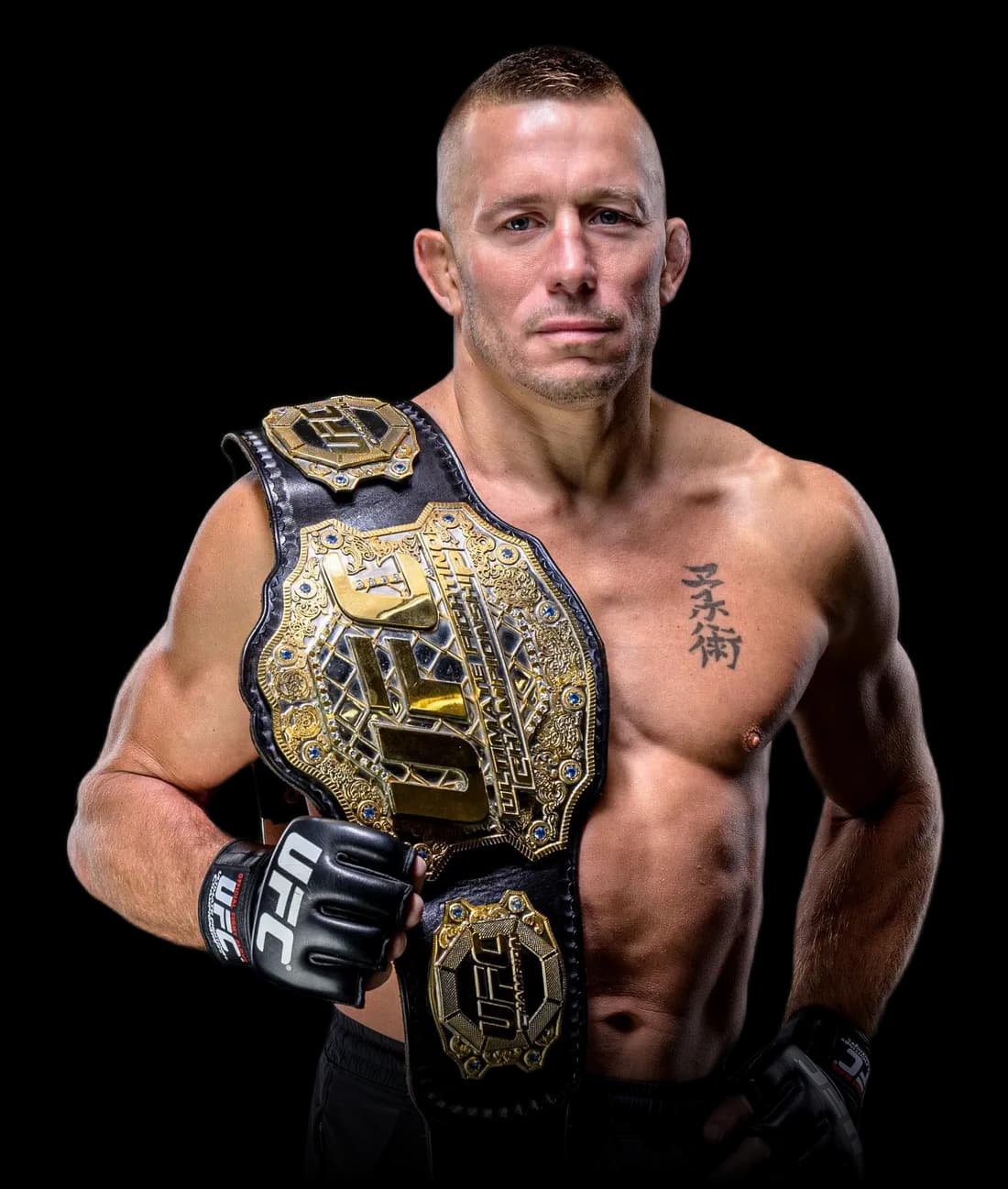 Georges St-Pierre holding the UFC championship belt